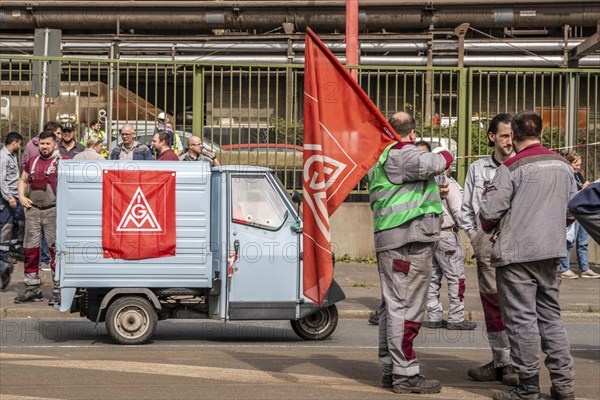 Steelworkers at a demonstration in front of the headquarters of ThyssenKrupp Steel Europe in