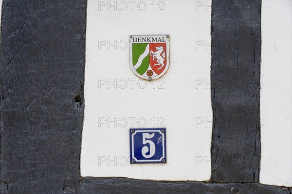 Listed building, mark of the state of North Rhine-Westphalia on a half-timbered house