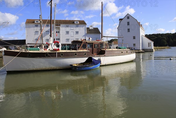Historic boat and Tide Mill on the waterfront, River Deben, Woodbridge, Suffolk, England, UK