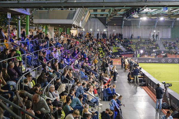 A crowd attentively watches a sporting event in a hall, Mercedes Benz Junior Cup, Glaspalast