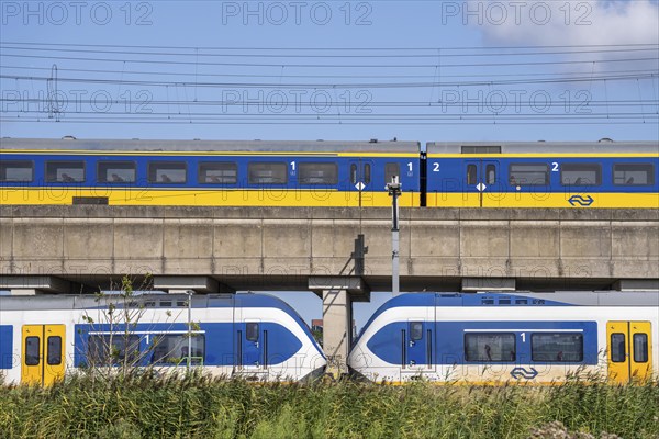 Trains of the Dutch railway, NS, Nederlandse Spoorwegen N.V., on a double-decker track, below local