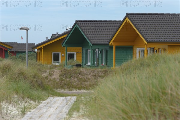 Colourful wooden houses for rent, dune village bungalow, dune of the offshore island of Heligoland,