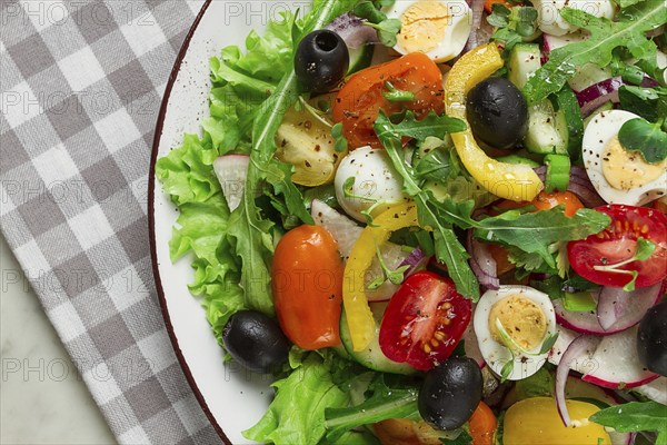 Vegetable salad, with quail eggs and olives, fresh, close-up, no people