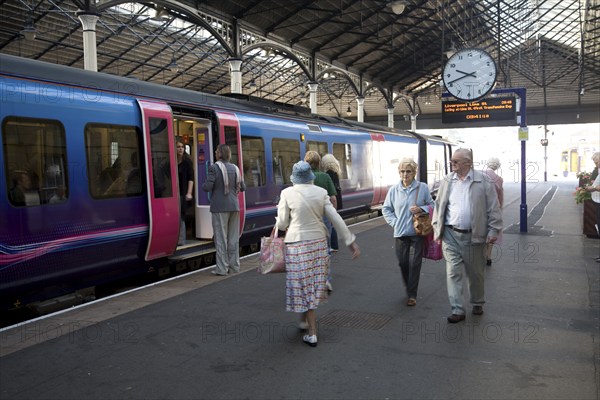 Train and passengers on platform of Scarborough railway station, Yorkshire, England, United