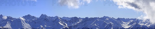 Alpine panorama with snow-covered mountain peaks in winter. Taken in the ski resort of Serfaus Fiss