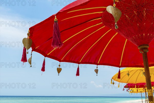 Traditional Balinese temple sunshade as parasol, Hinduism, symbol, beach holiday, protection, sun