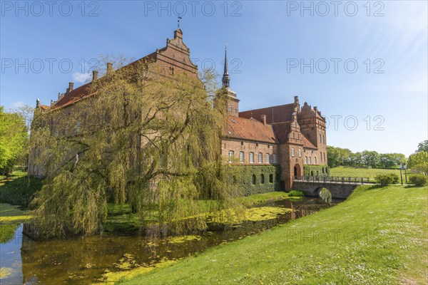 Holckenhavn Castle, hotel, brick building, castle church, castle moat, bridge, entrance gate, park,