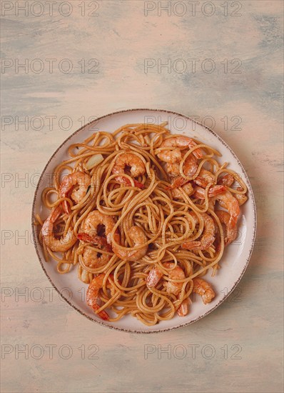 Spaghetti with king shrimps, with spices, top view, selective focus, homemade, no people