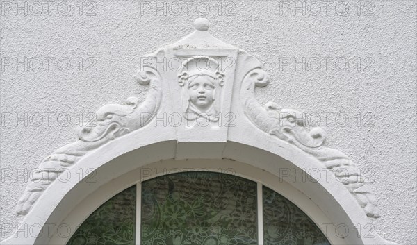 Relief of a girl's head above the fenaster of the oldest kindergarten in Lauf, 1850, Alter Schulhof