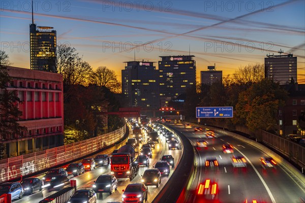 Evening traffic, partly with traffic jams, slow-moving traffic on the A40 motorway, skyline of