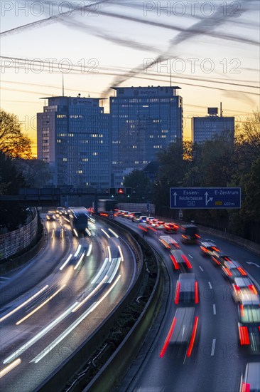 Evening traffic, partly with traffic jams, slow-moving traffic on the A40 motorway, Essen skyline,