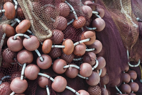 Close-up of fishing nets and orange buoys intertwined, Poros, Poros Island, Saronic Islands,