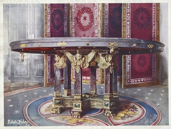 Furniture around the turn of the century 1900, Circular table of various marbles, with chased gilt