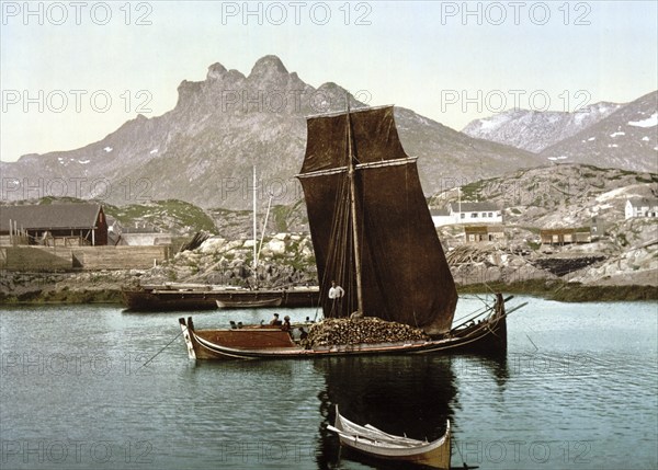 Print shows a Nordlandsbåt ship, outside of the town of Svolvær in the Lofoten district, Nordland