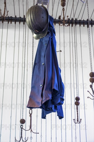 Changing room with pulleys and chains to hoist coal miners clothes at Le Bois du Cazier, coal