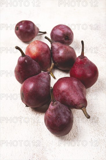 Red pears scattered on the table, barletta pear, selective focus, no people