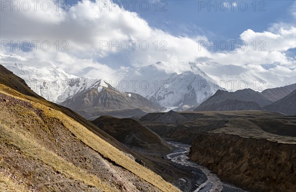 Achik Tash river, Achik Tash valley, behind glaciated and snow-covered mountain peak Pik Lenin,