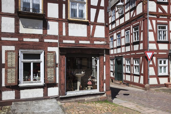 Half-timbered houses in the old town centre, antique shop, Schlitz, small town in the east of the