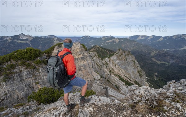 Hiker on the Schinder, Tegernsee mountains in the Mangfall mountains, Germany, Europe