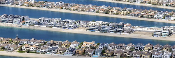 Artificial island in the shape of a palm tree The Palm Jumeirah with luxury villas property