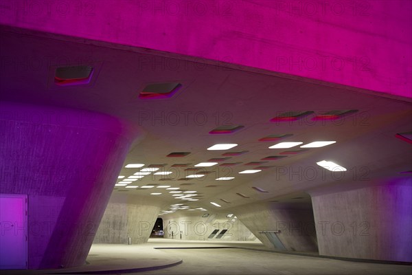 The colourfully illuminated phæno building, an experimental landscape and a science centre in the