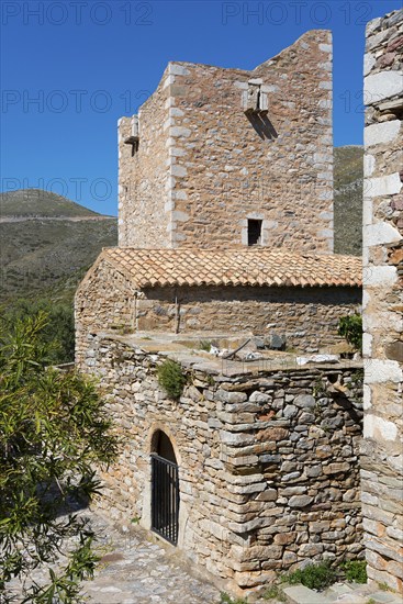 Detailed view of a traditionally built stone tower in a village landscape, residential tower,