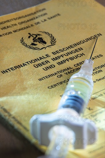 Symbolic photo vaccination, vaccination certificate, syringe with vaccine