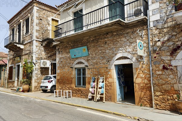 Typical stone houses with shops, souvenir shops, Stoupa, former fishing village, Mani, Greece,