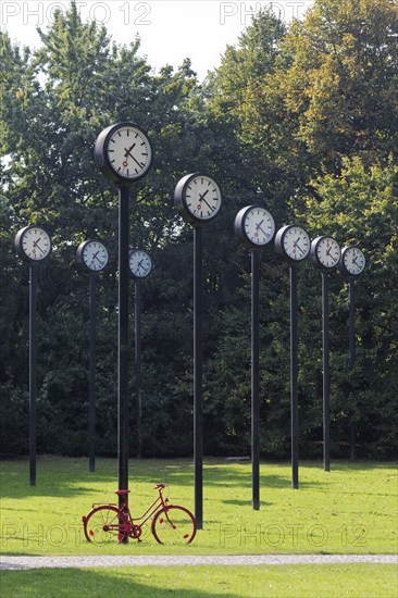 Station clocks with synchronised time, art installation Zeitfeld by Klaus Rinke in the Volksgarten