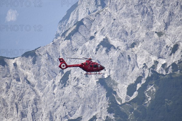 Airbus H135 helicopter in use as a rescue helicopter for the emergency doctor and the mountain