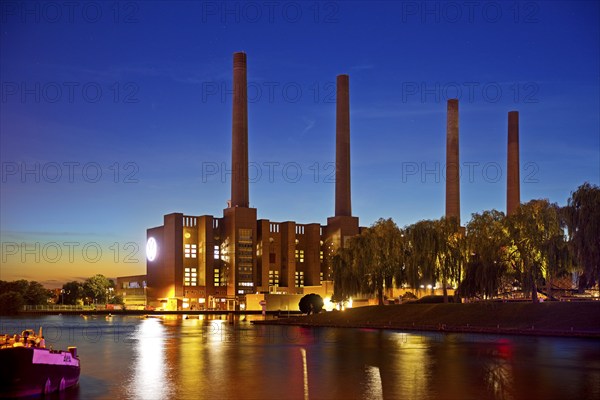 Wolfsburg NordSüd cogeneration plant in the evening with Mittellandkanal, Volkswagen AG main plant,
