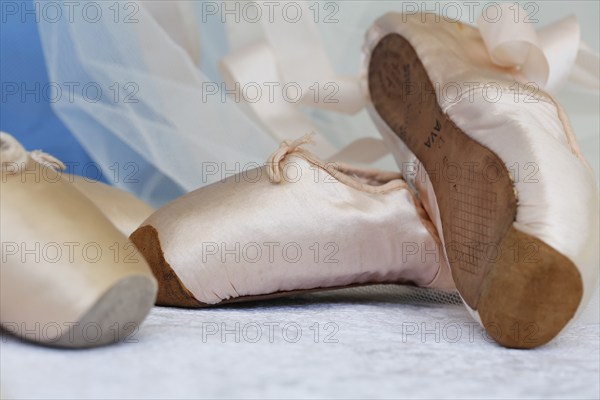 Ballet shoes, pointe shoes, dance shoes covered with satin in light pink colour, leather sole,