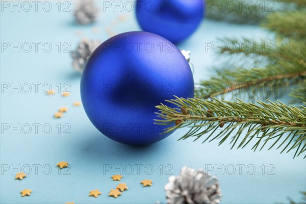 Christmas or New Year composition. Decorations, blue balls, cones, fir and spruce branches, on a