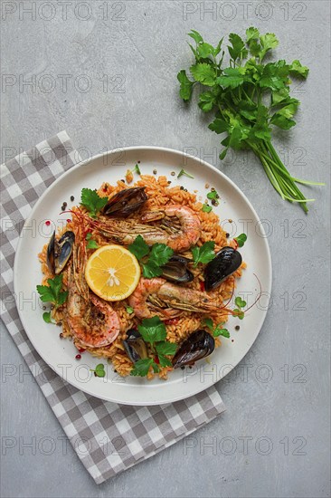 Seafood paella, shrimp and mussels risotto, rice, homemade, top view, no people