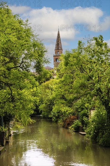 River Lemene with view of the cathedral of S. Andrea APostolo, medieval old town, Portogruaro,