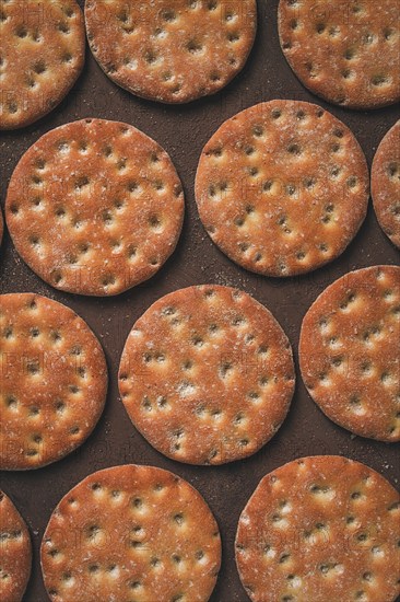Crispbread, round, with salt and herbs, top view, food concept, no people