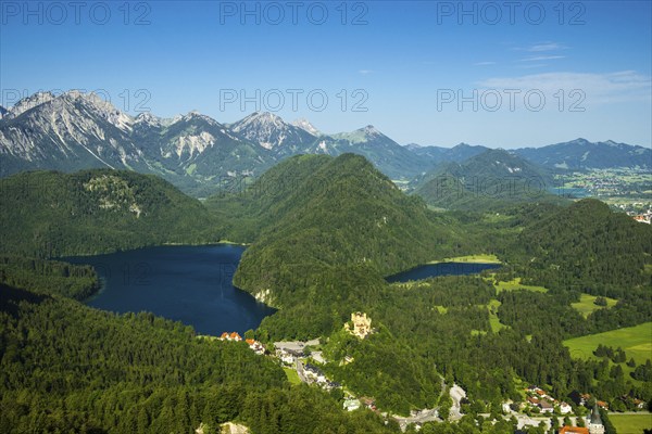 Hohenschwangau Castle, behind it Alpsee and Schwansee, Schwangau, Ostallgaeu, Allgaeu, Swabia,