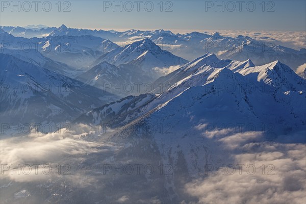 Mountain peaks above high fog, evening light, winter, backlight, view from Zugspitze to Daniel and