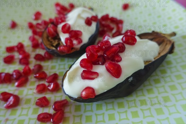 Mediterranean cuisine, roasted aubergines with pomegranate seeds and yoghurt, starter, healthy,