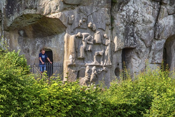Cross relief at the Externsteine, sandstone rock formation. Horn-Bad Meinberg, Teutoburg Forest,