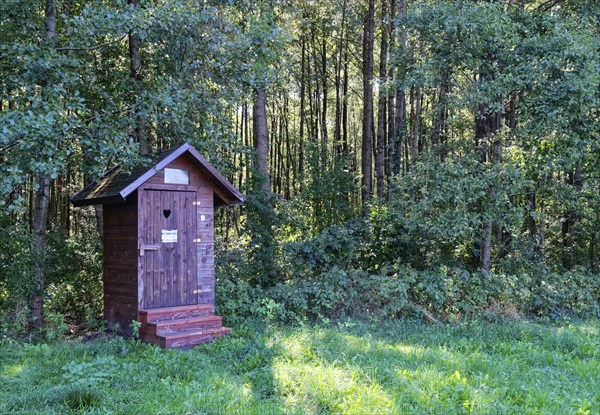 Wooden toilet block in a car park for hikers in the south of the Wigry National Park near Krusznik