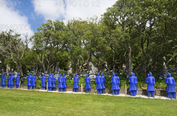 A row of blue terracotta soldier statues stands in a park-like setting, Bacalhôa, Bacalhoa Buddha