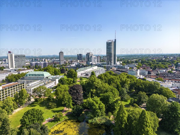 The skyline of Essen city centre, with the RWE Tower on the right and Stadtgarten Park in front,