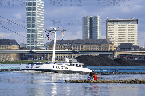 The Rhine near Düsseldorf, cargo ship, coal freighter, skyline, Rhine knee bridge, North