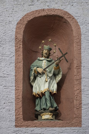 Figure of St Nepomuk in a niche in a residential building, Rottweil, Baden-Württemberg, Germany,