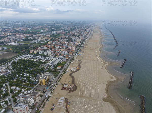 Bathing beach in Rimini. Bathing beach on the Adriatic in bad weather. All deckchairs are free.