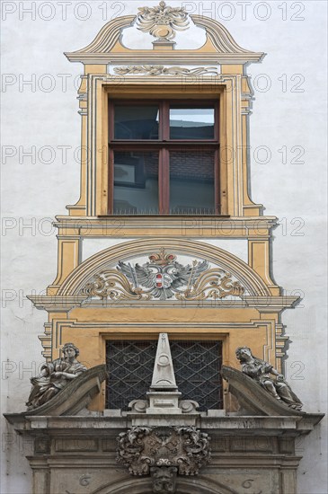 Detailed view of the entrance portal with the Alegories of Faith and Peace of the Baroque Town Hall