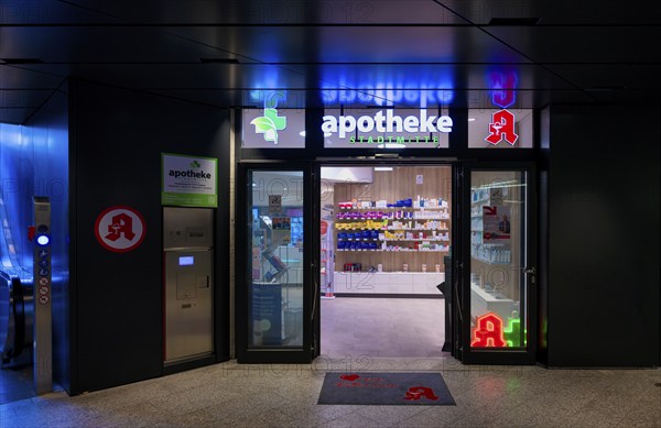 Night shot, pharmacy city centre, logo, subway, escalator, neon light, illuminated, Stuttgart,