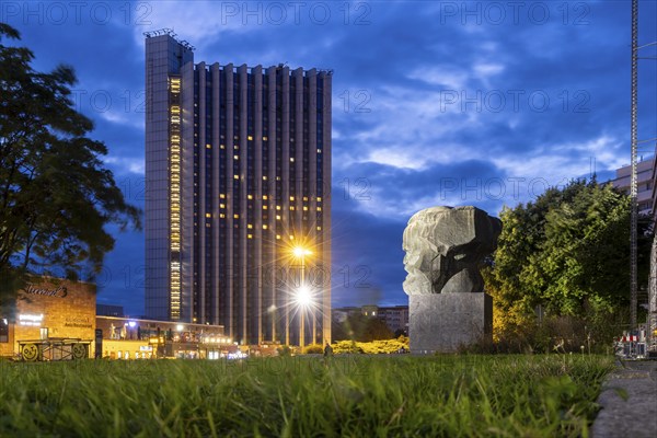 Karl Marx Monument at night. A 40-tonne sculpture, the city's most famous landmark. Congress Hotel.