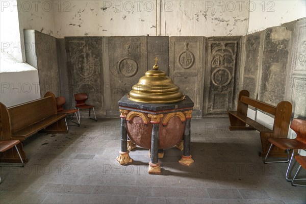Baptismal font in the interior of the collegiate church of St Castor in Karden, Treis-Karden,